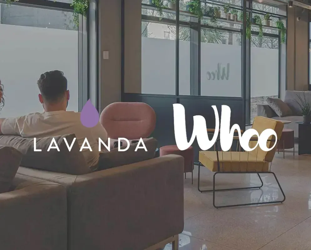 The Lavanda and Whoo marks over a resident lounge with floor-to-ceiling windows.