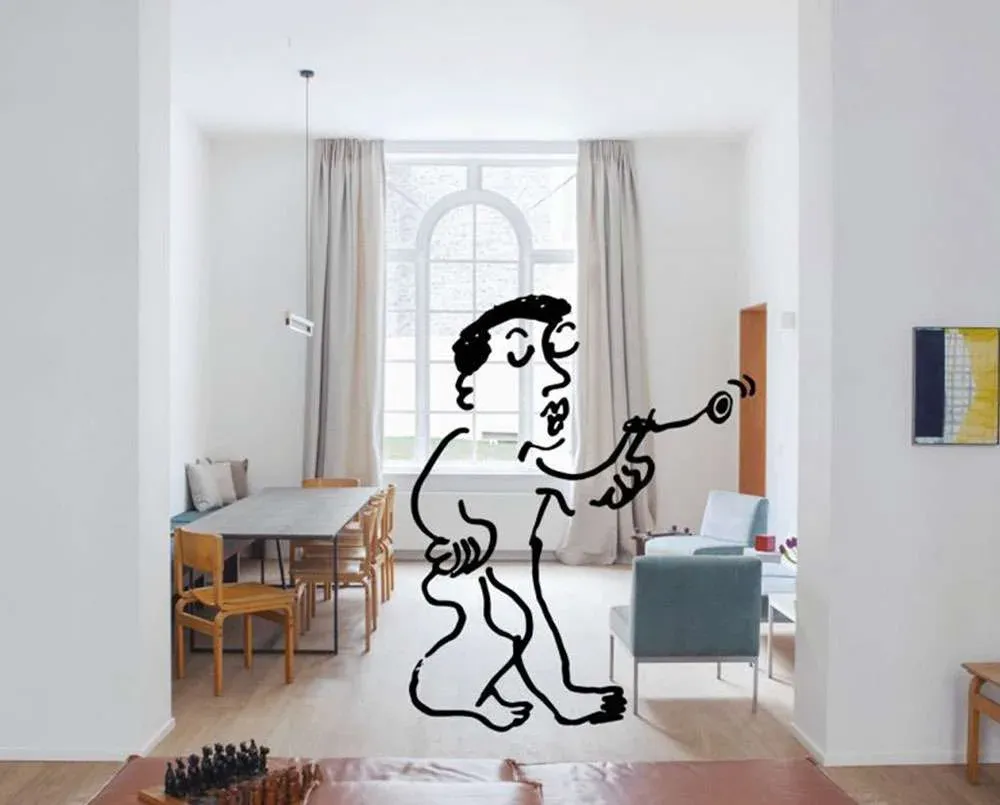 A pared-back apartment interior with a line drawing of a figure sketched over it.
